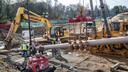 Pipefitters, left, work to connect a long segment of pipe that is being suspended in air to make it ready to be pulled undergroud in a residential area of West Chester, PA on Ship Road and South Pullman Drive as part of the Mariner East Pipeline that is going through the area on November 11, 2019