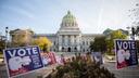 Signs outside Pennsylvania's capitol reminding people to vote before polls close Tuesday.