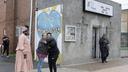 Penny Martin (left) and the Rev. Michelle Simmons, founder and executive director of Why Not Prosper, hug outside of a recovery home in Philadelphia. Simmons said the new licensing system will "make owners … step up their game."