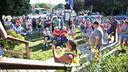 People gather on the front lawn outside of the Tioga borough building.