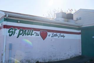 St. Paul’s Catholic Church sits between rows of small, distinctive townhouses with touches of the Erie neighborhood’s history painted on fences and sides of buildings.